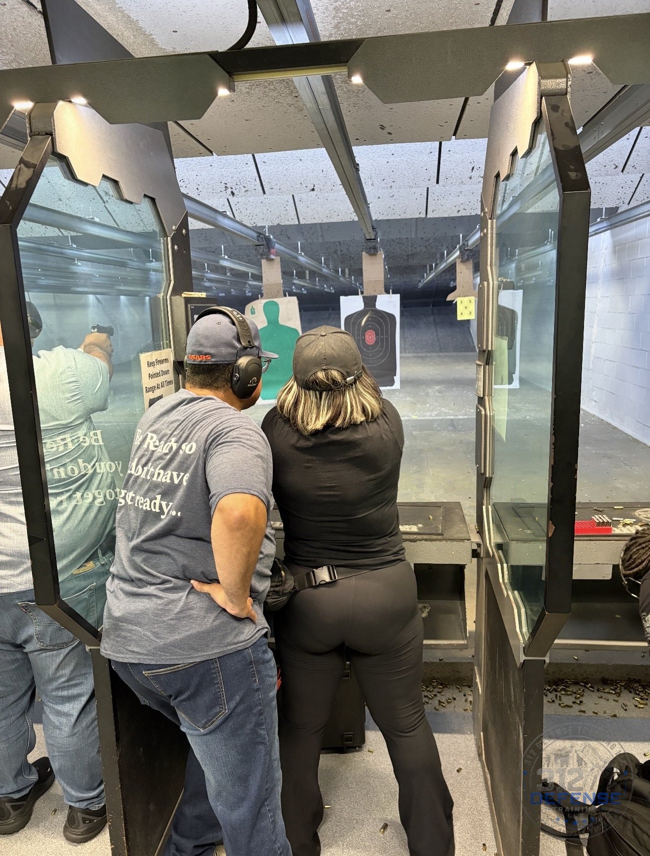 Student receiving one-on-one firearms instruction at the range