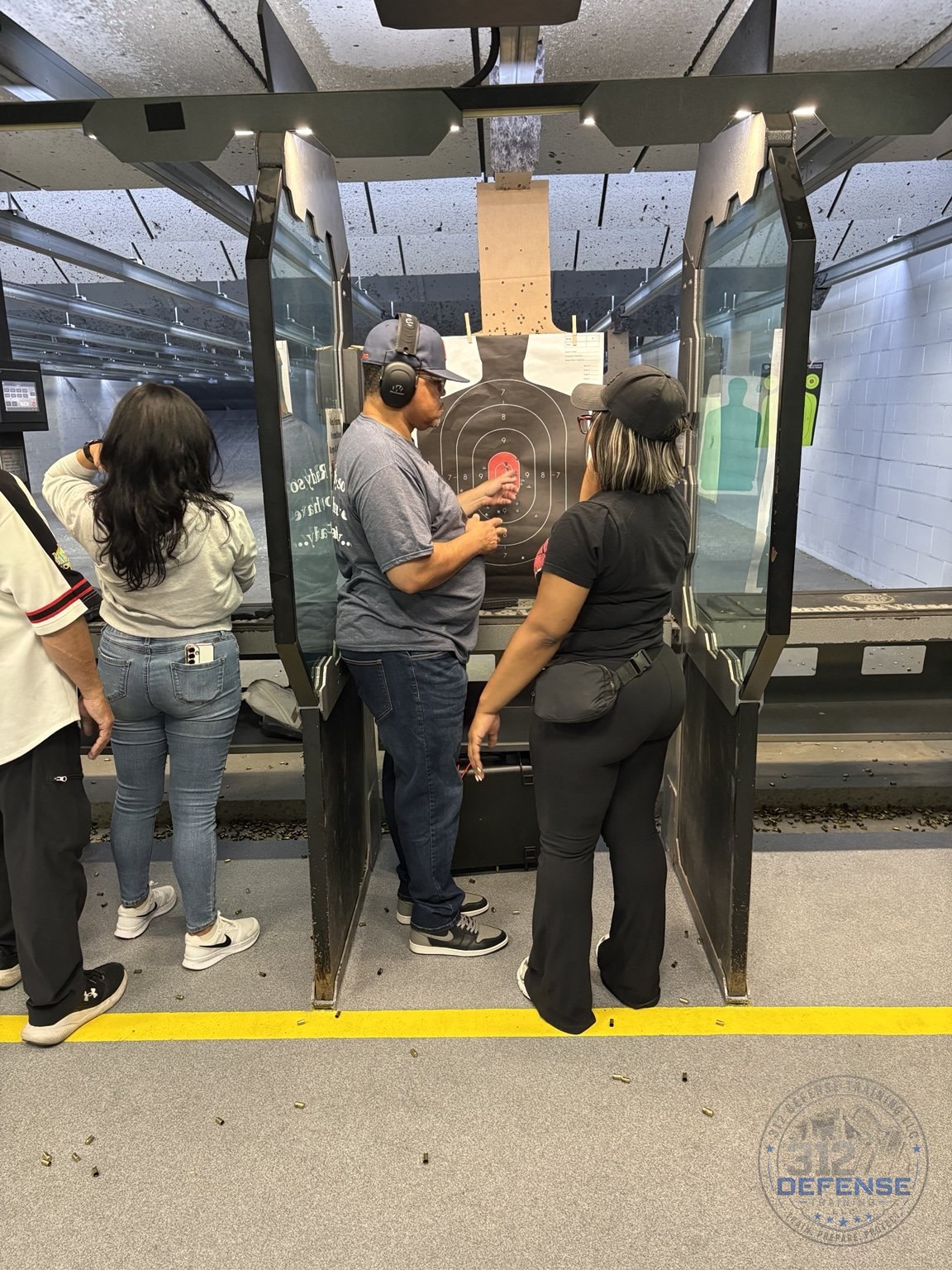 Instructor discussing shot placement with a student at the range